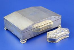 A 1950's Art Deco style engine turned silver cigarette box, of rectangular form, with shaped lid and