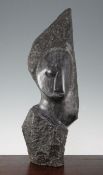 A Shona black serpentine carving of a head, possibly by John Takawira (1938-1989), with an