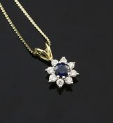 An 18ct gold, sapphire and diamond cluster pendant of flower head design, on a 14ct gold fine link