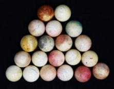 A collection of twenty early 20th century ivory snooker balls, some with traces of original