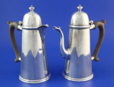 A George V 18th century style silver cafe au lait pair by William Comyns & Sons Ltd, with wooden