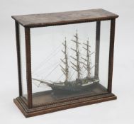 A scratch built model of a three mast clipper, with an oak glazed display case, with ropetwist