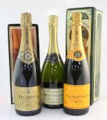 Five assorted bottles of champagne including one Moet & Chandon 1988, in original tin box; one