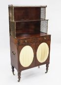 A Regency mahogany chiffonier, with two open shelves fitted with lattice brass gallery and side