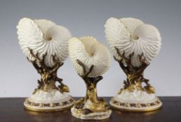 Three Royal Worcester 'nautilus shell' vases, late 19th century, comprising a pair and a smaller