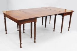 A George IV mahogany extending dining table, with ropetwist legs and turned ball feet, W.3ft 8.