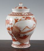 A Chinese rouge-de-fer baluster vase and cover, painted with reserves of an old fisherman, on a