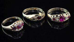 Three early 20th century 18ct gold and gem set rings, to include, ruby and diamond, garnet and