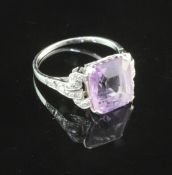 A 1920's/1930's platinum, amethyst and diamond ring, with emerald cut amethyst and eight cut diamond