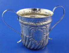 An early 19th century provincial demi spiral fluted silver porringer, with scroll handles, IW?,