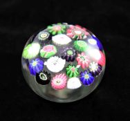A Clichy spaced millefiori glass paperweight, late 19th century, with multi coloured complex