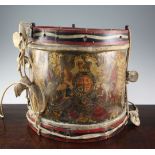 An early 20th century military brass drum for the Gloucestershire Regiment, decorated with battle