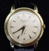 A gentleman's 1950's 18ct gold Patek Philippe Calatrava manual wind wristwatch, with arrowed baton