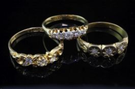 Three late 19th/early 20th century 18ct gold and diamond set rings, of various designs, gross weight