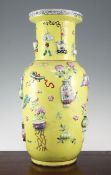 A large Chinese yellow ground and moulded 'Hundred Antiques' vase, 19th century, decorated with