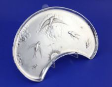 An Edwardian kidney shaped silver tray with aesthetic decoration, embossed with swallows in flight