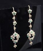 A pair of late Victorian gold, emerald and seed pearl set drop earrings, with foliate motifs,