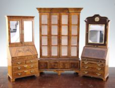 A Fergus Lane miniature 18th century style walnut bookcase, 11in., together with a similar 18th