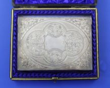 A cased late Victorian silver mounted notecase/wallet by Hilliard & Thomason, chased and engraved