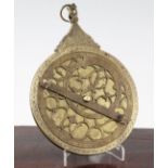 A Persian engraved brass astrolabe, probably 19th century, with pierced dials and engraved scale