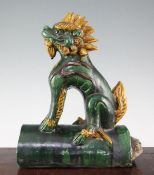 A Chinese Sancai glazed 'qilin' ridge tile, Ming dynasty or later, the mythical beast seated on