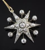 An early 20th century gold, silver and diamond star pendant brooch, set with graduated old cut