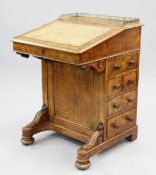 A Victorian walnut harlequin davenport, with pop-up stationery compartment, with leather inset