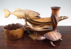 A collection of twenty one Pitcairn Islands souvenir carved hardwood models, including an HMS Bounty