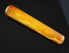 A cased mid 20th century 18ct gold mounted amber cigarette holder, 3.5in.