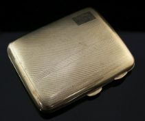 A George V engine turned 9ct gold cigarette case, of concave form, with interior inscription,