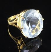 A 14ct gold and aquamarine dress ring, the fancy oval cut stone weighing approximately 25.00ct, size