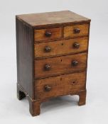 A small early 19th century mahogany chest, of two short and three long drawers with bun handles,