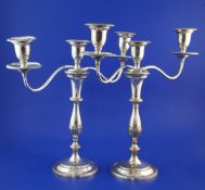 A pair of late 19th/early 20th century silver plated on copper two branch, three light candelabra,