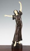 Peter Tereszczuk (Austrian, 1875-1963). A patinated bronze and ivory figure of a young lady dancing,