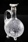 An Edwardian silver mounted rock crystal glass claret jug, c.1904, the quatre lobed flask shaped