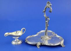 A late 19th/early 20th century French silver trefoil shaped condiment? stand, with flying scroll