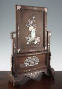 A Chinese rosewood and mother of pearl inlaid table screen, late 19th century, the rectangular panel