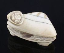 A Japanese ivory okimono of 'The Clam's Dream', 19th century, the exterior carved with shells and