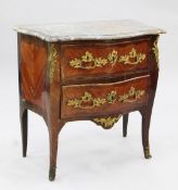 A Louis XVI marble topped and ormolu mounted serpentine commode, fitted with two drawers, on