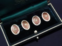 A pair of early 20th century 18ct gold, two colour enamel and seed pearl set cufflinks, of oval