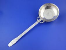 An early 20th century Turkish? silver serving ladle or small pan, with engraved handle and bowl with