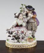 A Meissen gallant group, late 19th / early 20th century, modelled as a girl holding a letter with