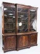 An Edwardian George III style mahogany breakfront bookcase, with dentil cornice and three astragal