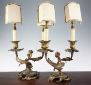 A pair of late 19th century ormolu two branch table lamps, modelled as flowering leafy scrolls, on