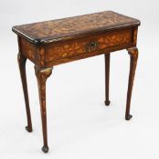 An 18th century Dutch oak and marquetry inlaid folding card table, the hinged top opening to