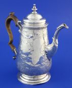 A George II silver coffee pot with later embossed decoration, of tapering cylindrical form, with