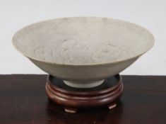 A Chinese Yingqing conical shaped bowl, Song dynasty, the interior incised with scrolling foliage,