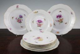 Eight Berlin porcelain plates, late 19th/early 20th century, each painted with flower sprays and