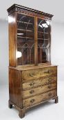 A George III mahogany secretaire bookcase, with moulded cornice over astragal glazed doors,