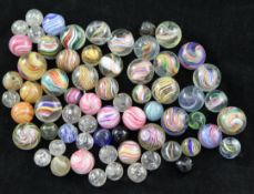 A collection of various Victorian marbles, including onion skin and coloured swirled examples,